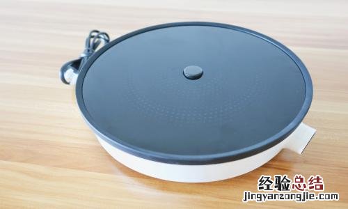 电磁炉报警e1怎么处理